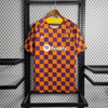 Camiseta de entrenamiento naranja, azul y roja del Barcelona 2023/24