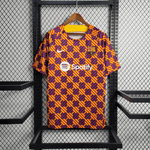 Camiseta de entrenamiento naranja, azul y roja del Barcelona 2023/24