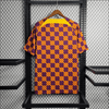 Camiseta de entrenamiento naranja, azul y roja del Barcelona 2023/24