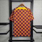 Camiseta de entrenamiento naranja, azul y roja del Barcelona 2023/24