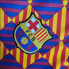 Camiseta de entrenamiento naranja, azul y roja del Barcelona 2023/24