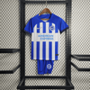 Kit local infantil del Brighton 2023/24
