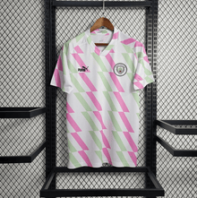 Camiseta de entrenamiento del Manchester City 2023/24 blanco y rosa