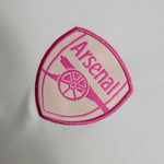 Camiseta de entrenamiento blanca y rosa del Arsenal 2023/24