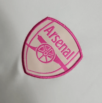 Camiseta de entrenamiento blanca y rosa del Arsenal 2023/24